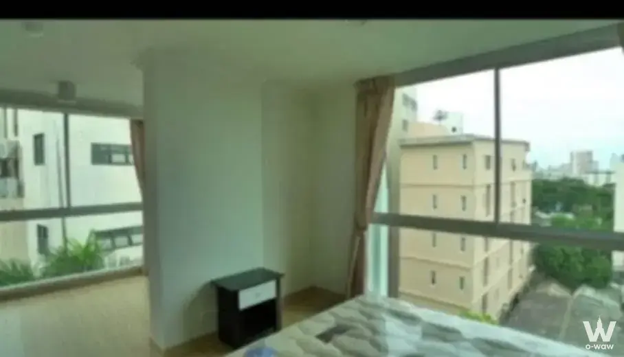 2-bed condo for rent in Chateau in Town Ratchada 20 with grey patterned bed and city view