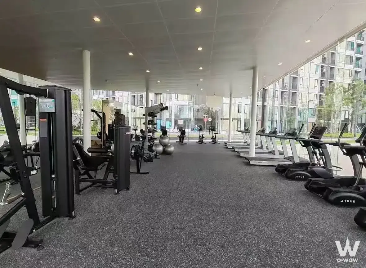Open-air gym with cardio machines and glass windows in a 2-bed condo for rent in Skyrise Avenue Sukhumvit 64