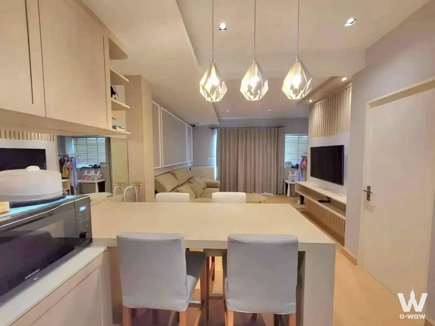 Spacious 2-bed townhouse for sale in Indy 2 Bangna with open-plan living, dining, and kitchen area