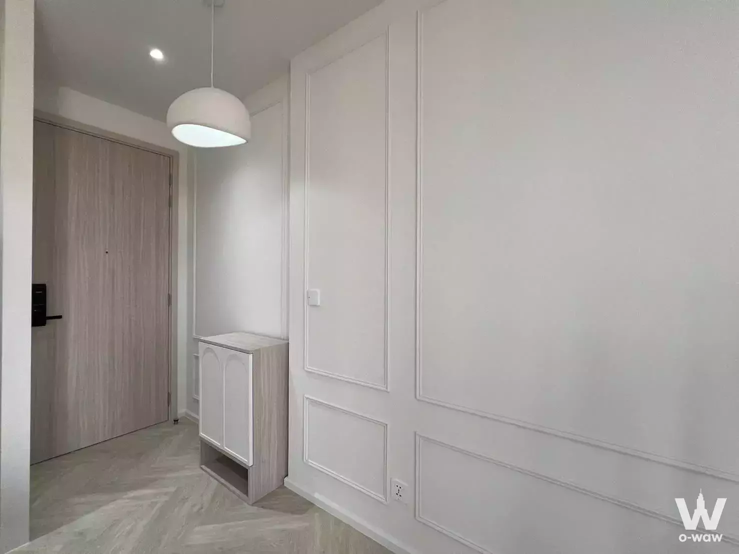 Entryway in 2-bed condo for sale at The Privacy Taopoon Interchange with herringbone wood floors and smart lock