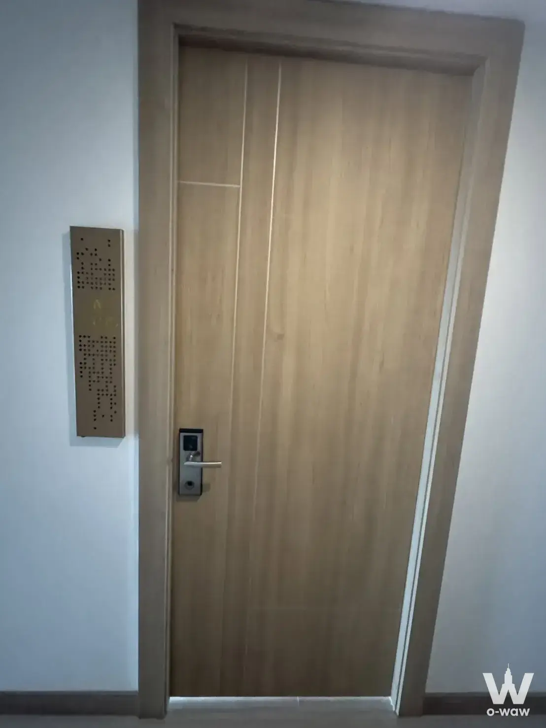 Light oak door with smart lock in The Riviera Wongamat Beach 1-bed condo for sale