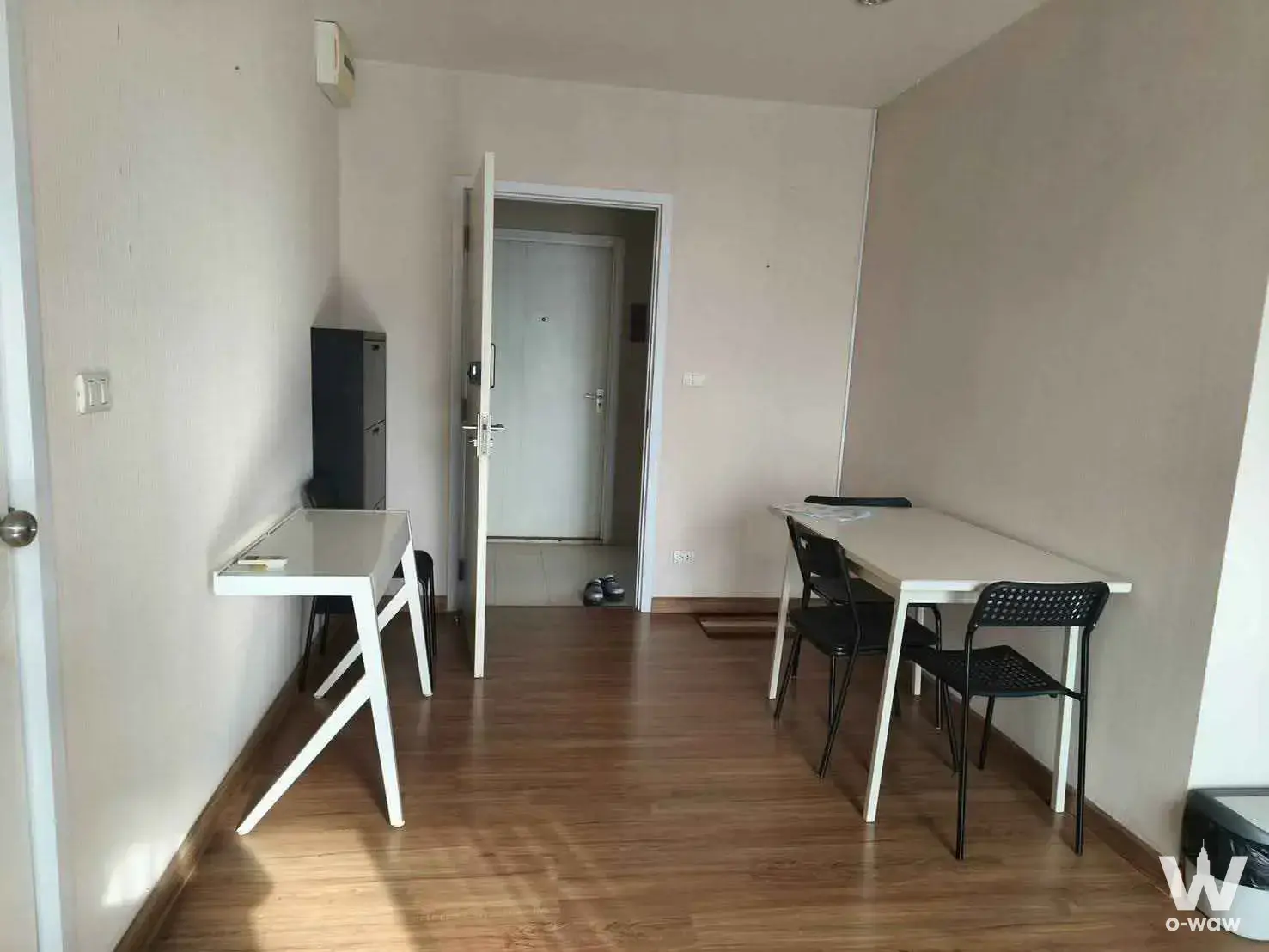 Compact dining and study area with white table and desk in The Tree Interchange