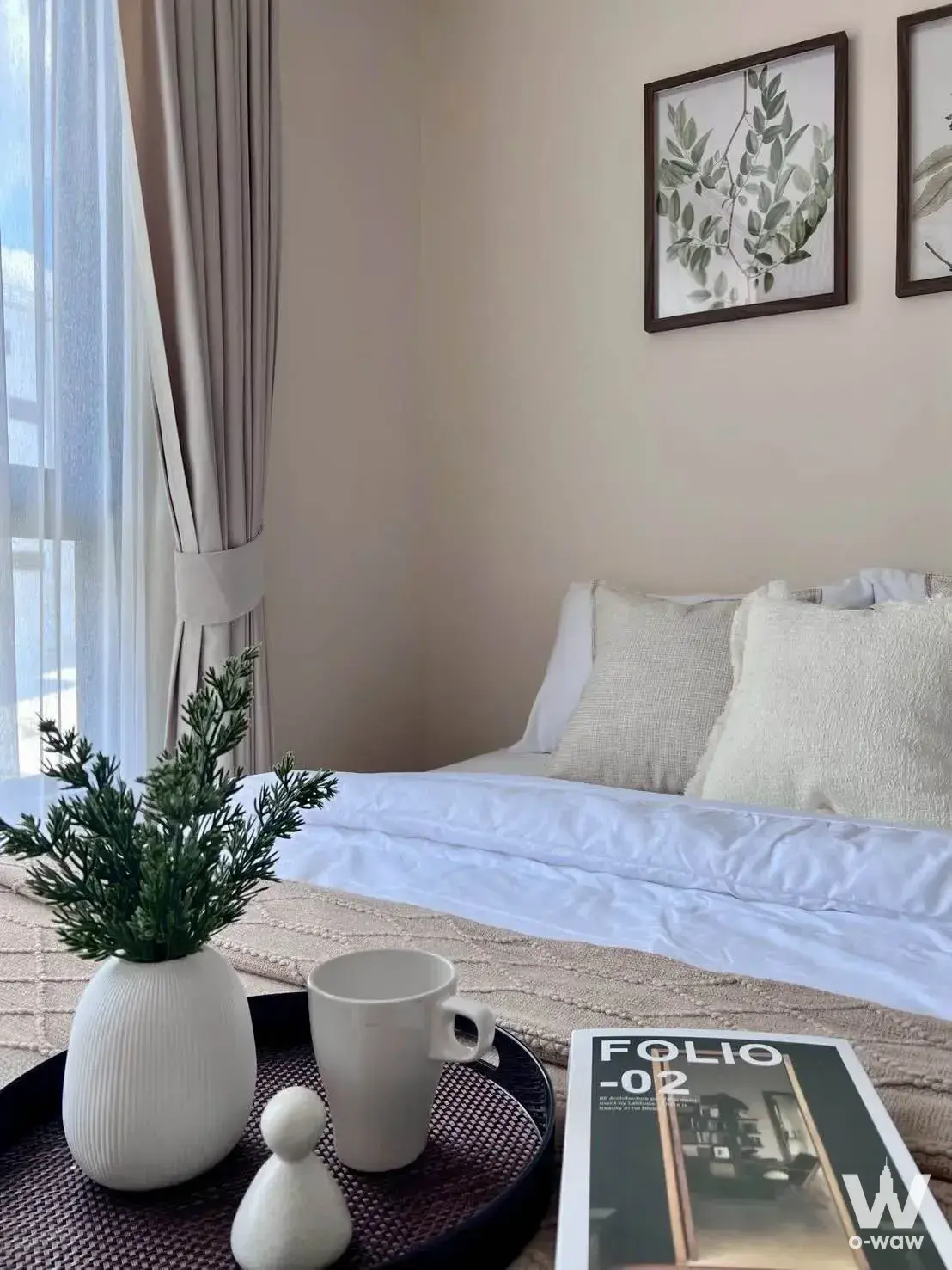Bedroom in The Belgravia @ Ratchada 17 featuring queen bed with white linens, botanical prints, and natural light