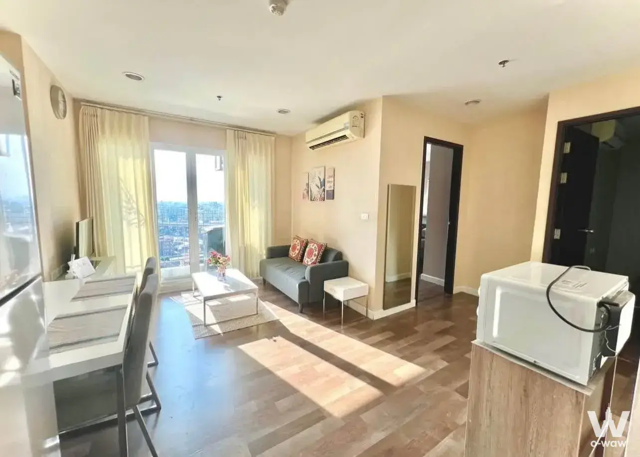 Modern 2-bed condo for rent in Diamond Sukhumvit featuring herringbone floors and city skyline views