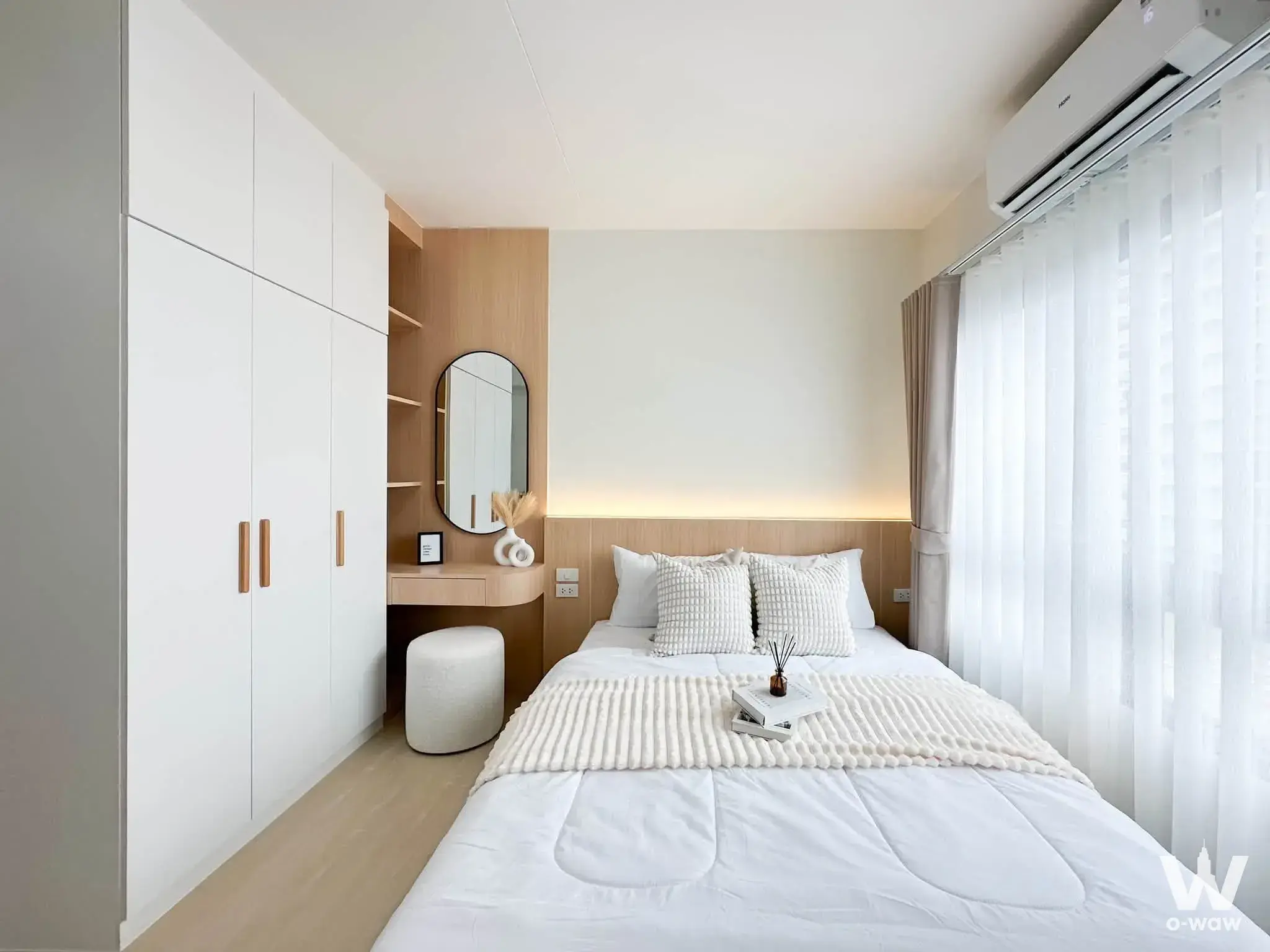 Modern minimalist bedroom in 624 Condolette with LED headboard lighting and integrated vanity desk