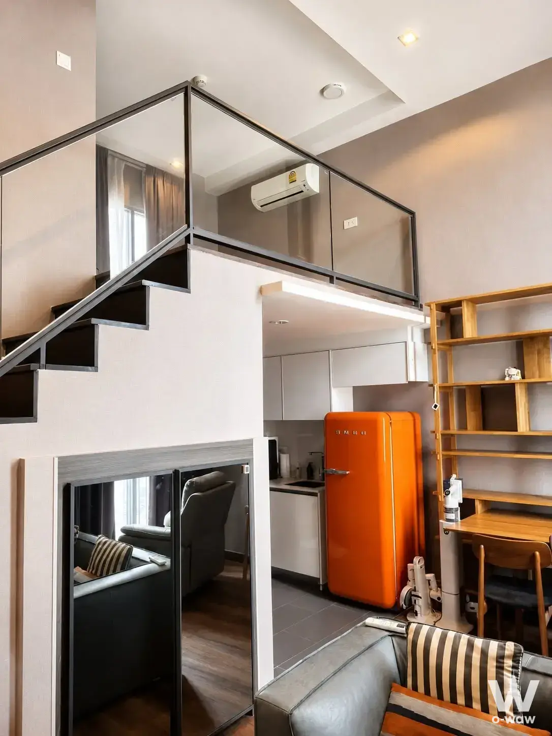1-bed condo for sale in C Ekkamai Condominium featuring a loft-style interior with an open staircase and modern industrial