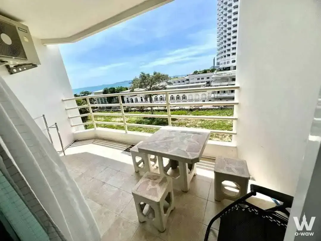 Balcony at View Talay 8 condo featuring marble-top table and ocean horizon view