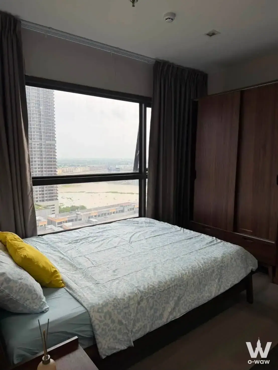 High-floor bedroom with built-in wardrobe in a The Politan Aqua rental unit