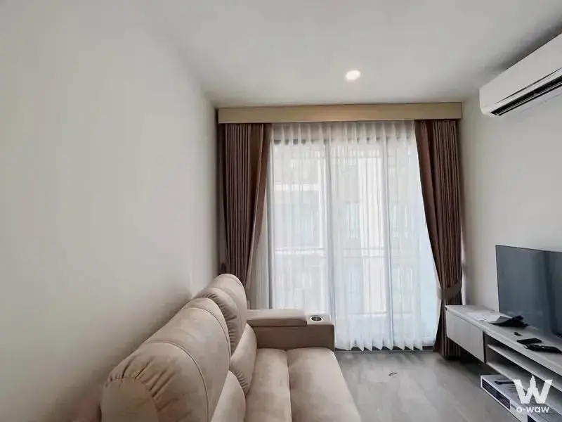 Modern living room in Brixton Pet&Play Sukhumvit 107 featuring beige leather sofa