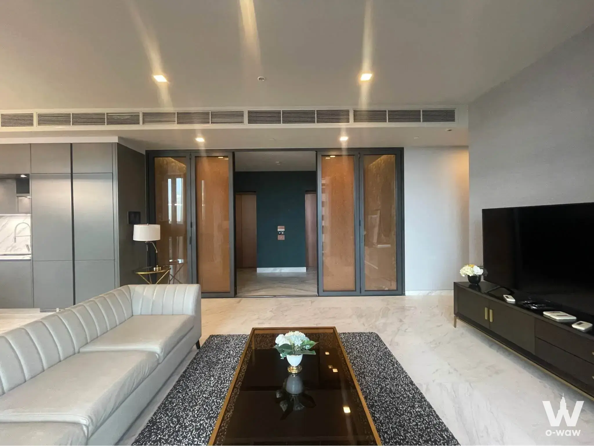 Luxury living room with gold accents in The Monument Thong Lo condo