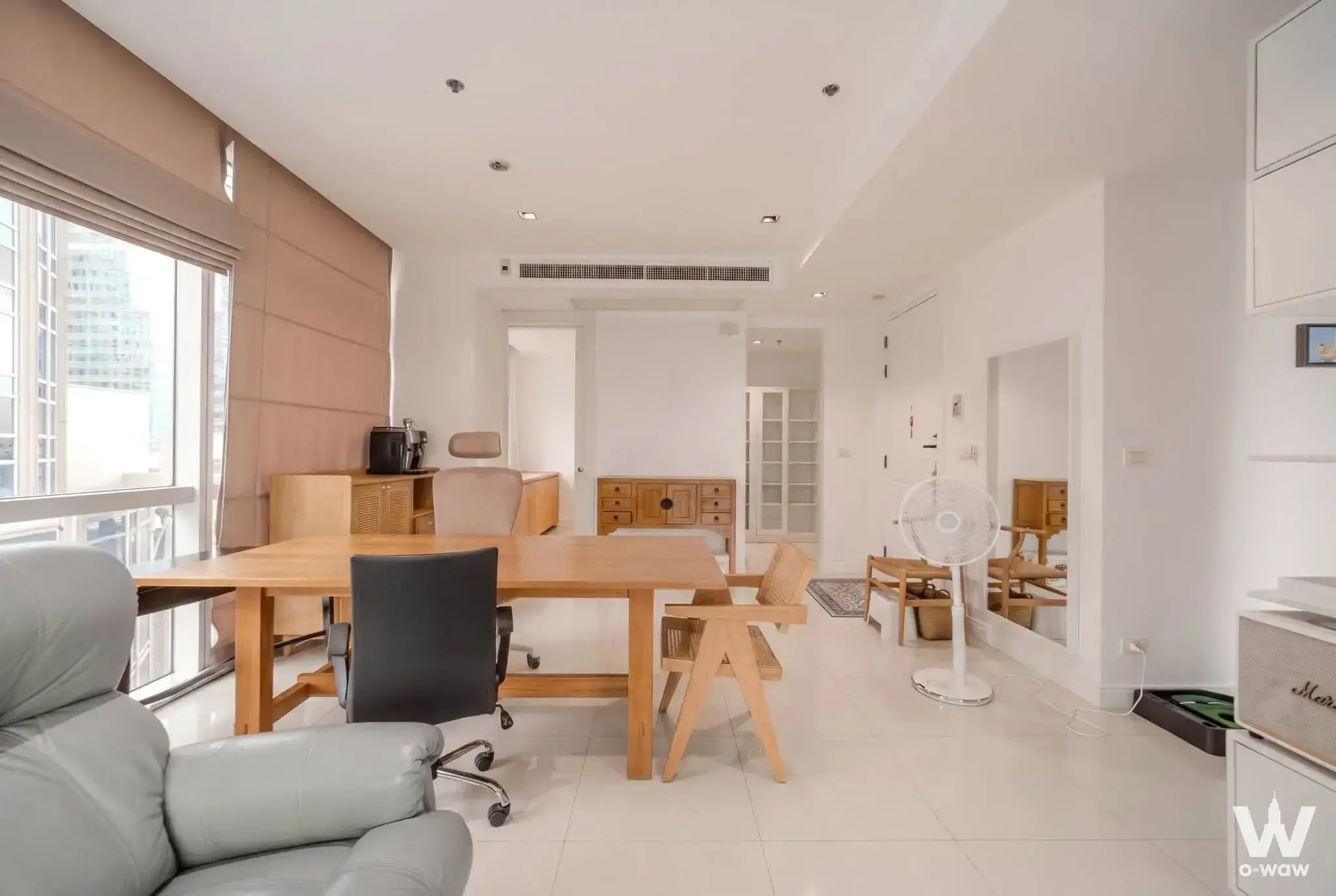Athenee Residence 2-bed condo home office space with light-wood desk and minimalist decor