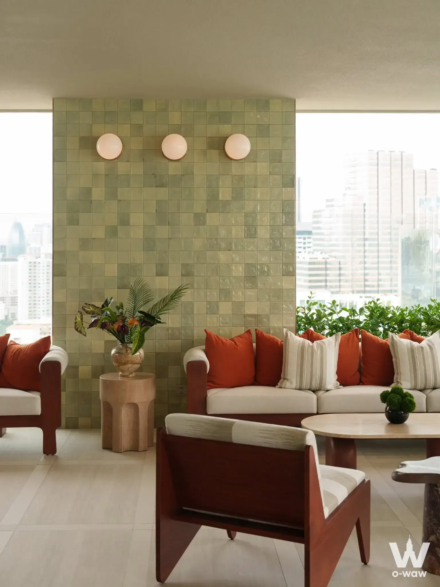 1-bed condo for sale in Via Ari with sage-green tiled feature wall and city skyline view