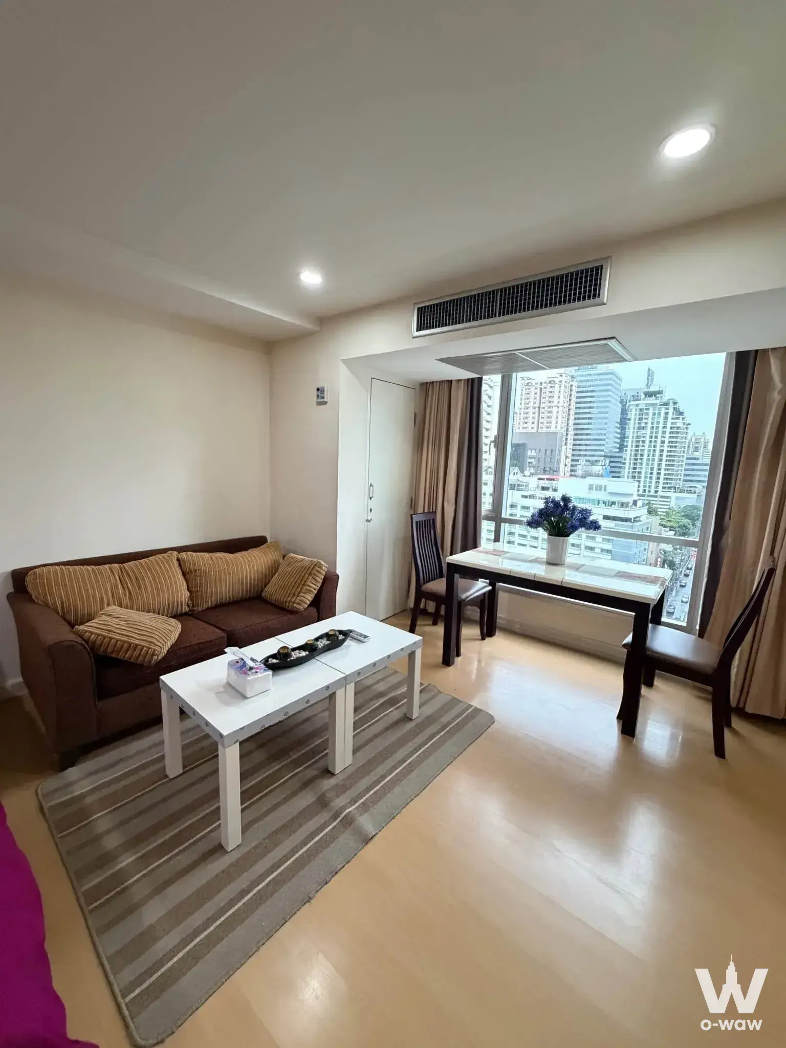 Dining nook in The Trendy Condominium 1-bed condo with marble table and floor-to-ceiling city views