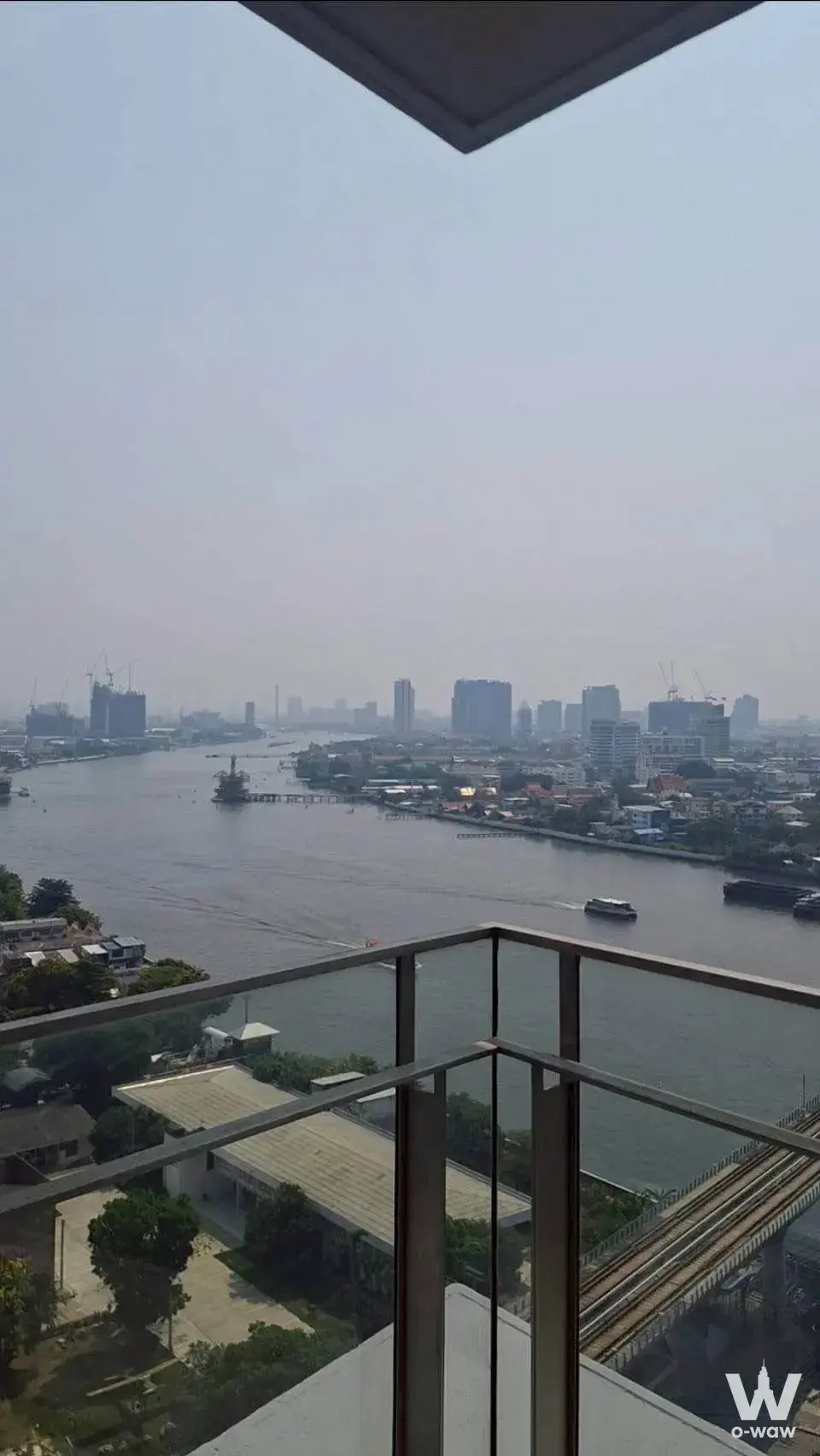 High-floor balcony view of the river and city skyline from 333 Riverside
