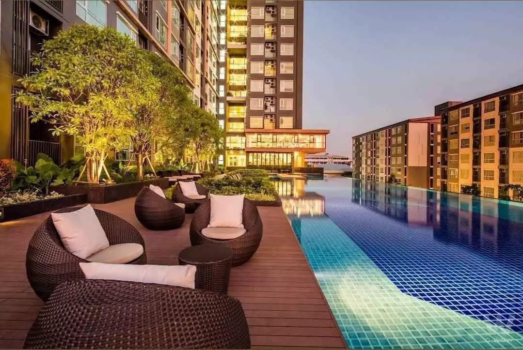 Rooftop infinity pool and lounge deck at Fuse Sense Bangkae with high-rise city views