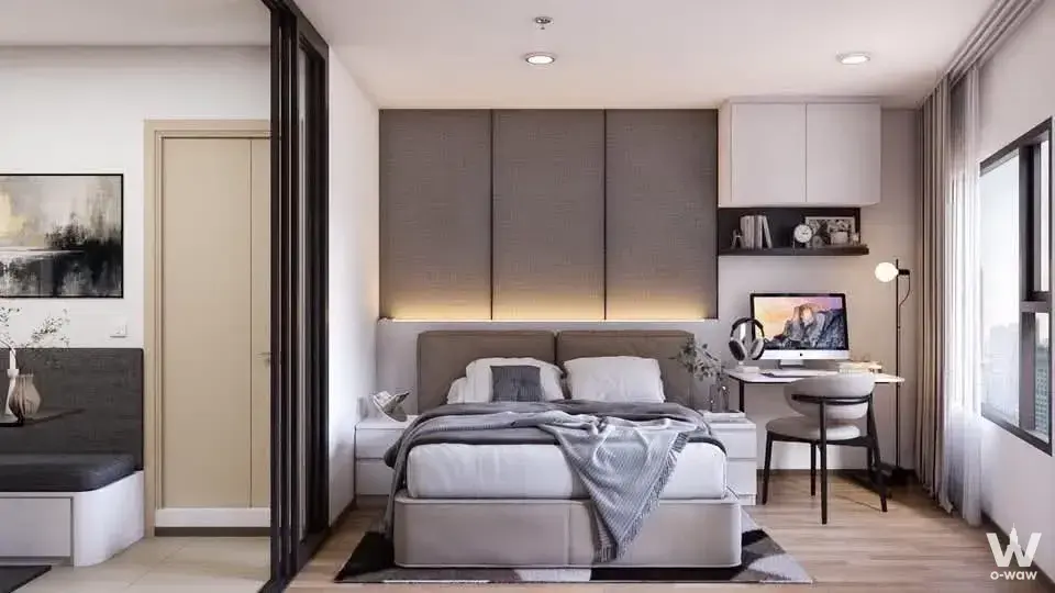 Modern 1-bed condo bedroom in Life Rama 4 - Asoke with grey fabric feature wall and LED lighting