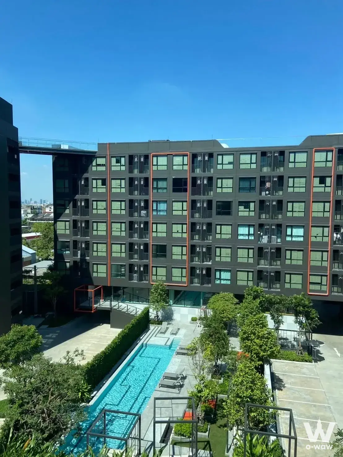 Origin Play Sri Udom exterior with turquoise pool and modern grey facade