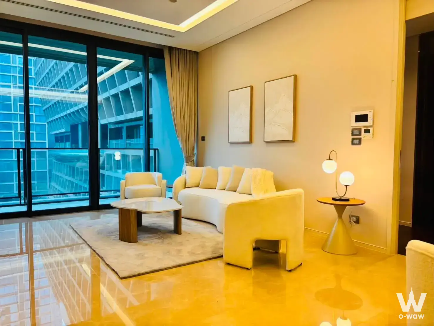 Luxury 2-bed condo living room for sale in Sindhorn Residence featuring marble floors, recessed lighting, and balcony view
