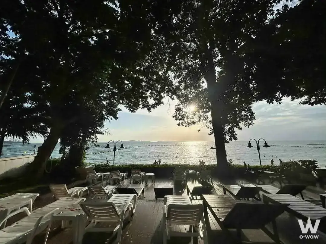 Sunset deck with lounge chairs and sea views at Sky Beach Condominium