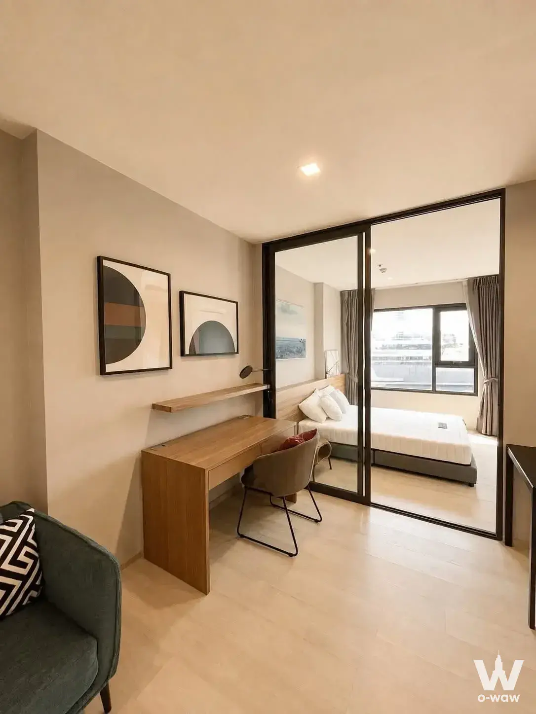 Modern 1-bed condo for rent in Life One Wireless with sliding glass doors and wood desk