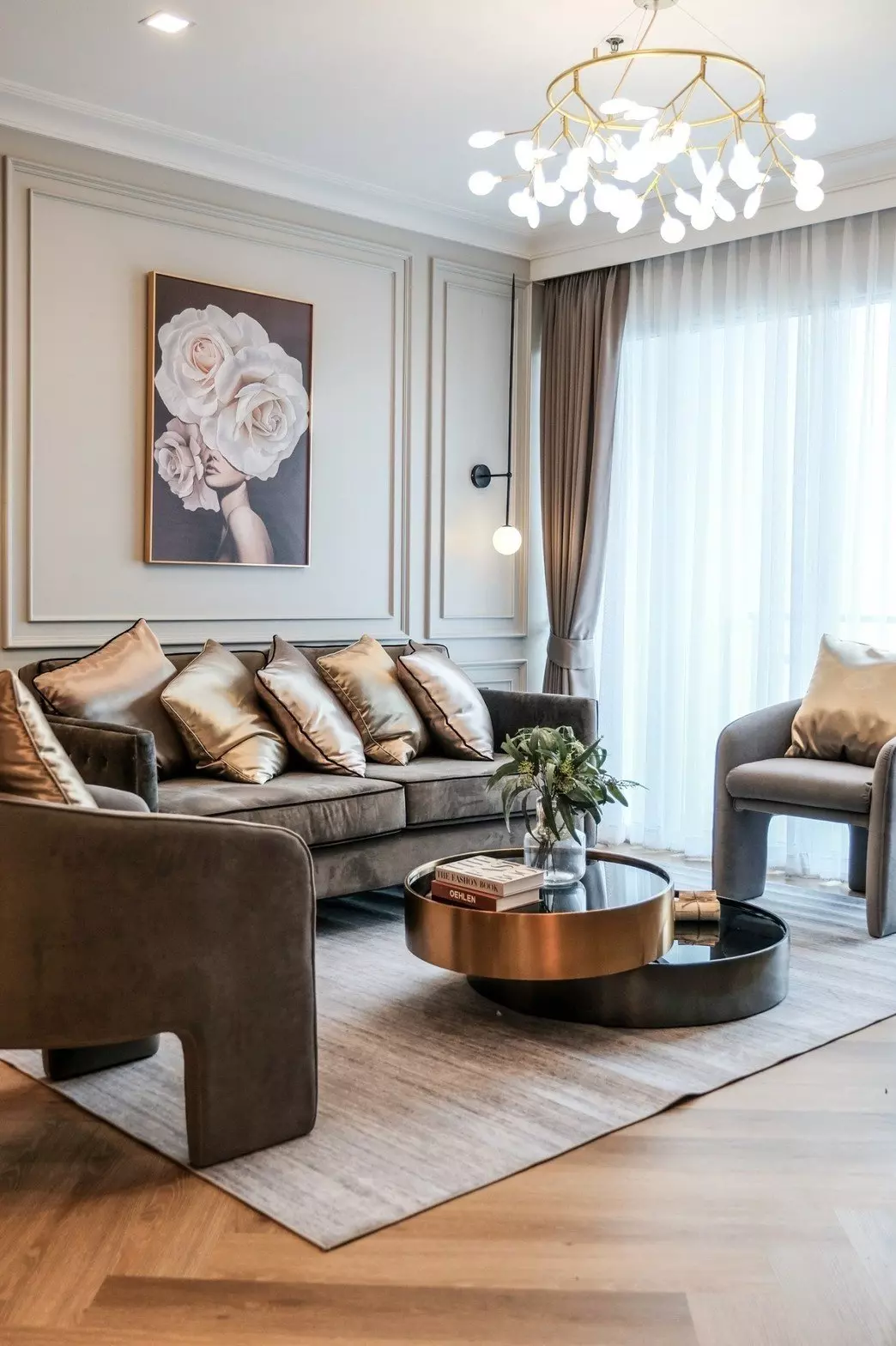 Luxury living room in Nusasiri Grand Condo showcasing gold accents and floor-to-ceiling windows