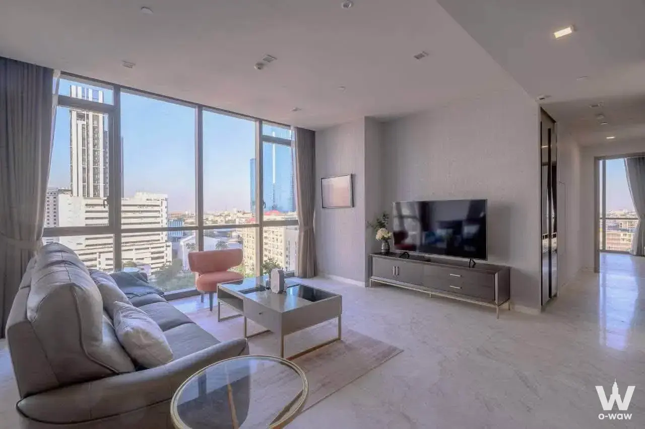 2-bed condo for sale in The Monument Thong Lo living room with city skyline view and modern furniture
