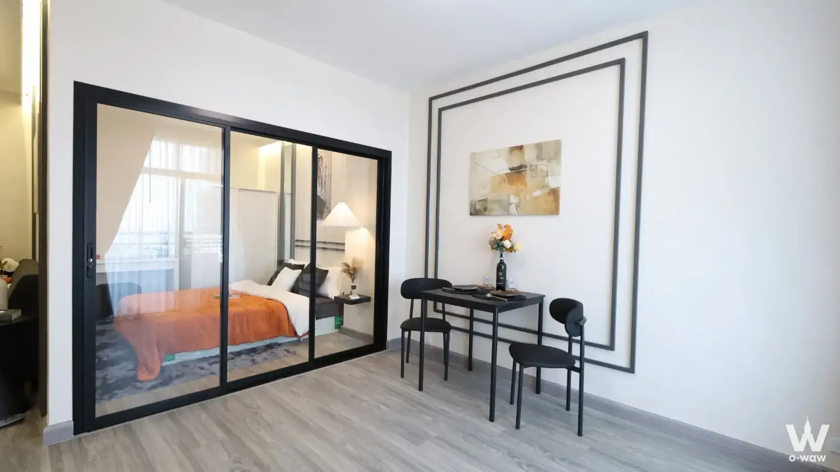1-bed condo for sale in อาคารไทยรงค์ทาเวอร์ featuring a glass partition bedroom, minimalist dining nook, and modern decor