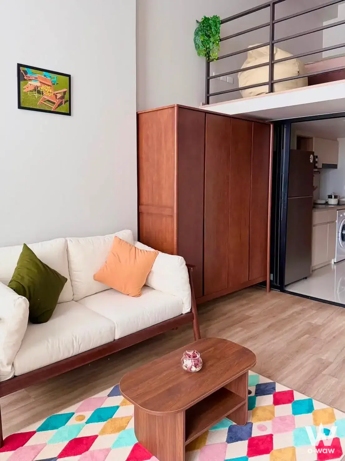 Bright loft studio in Culture Thonglor with mezzanine level and colorful geometric rug
