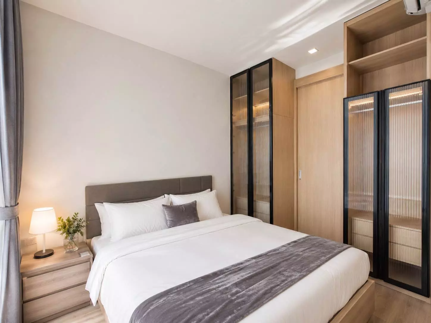 Noble State 39 bedroom with fluted glass wardrobe and taupe upholstered bed