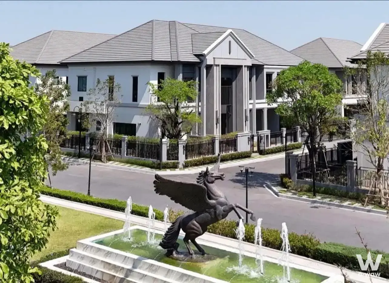 Grand Bangkok Boulevard Suksawat-Rama3 townhouses with bronze Pegasus fountain and manicured lawn