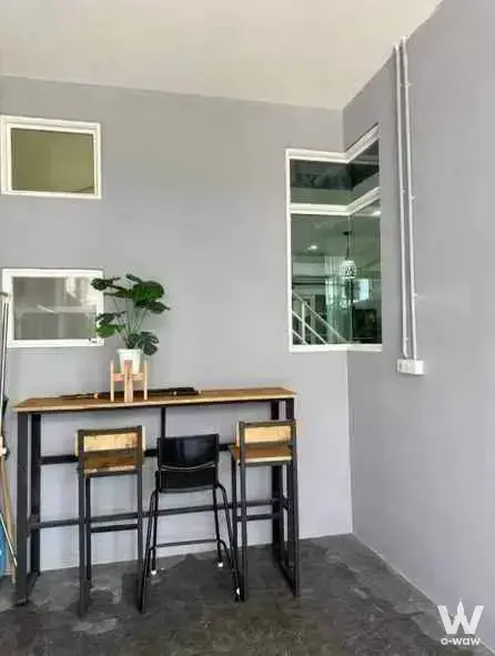 Industrial dining nook with bar table and stools for rent in a 4-bed townhouse at Golden Town 3 Bangna-Suanluang