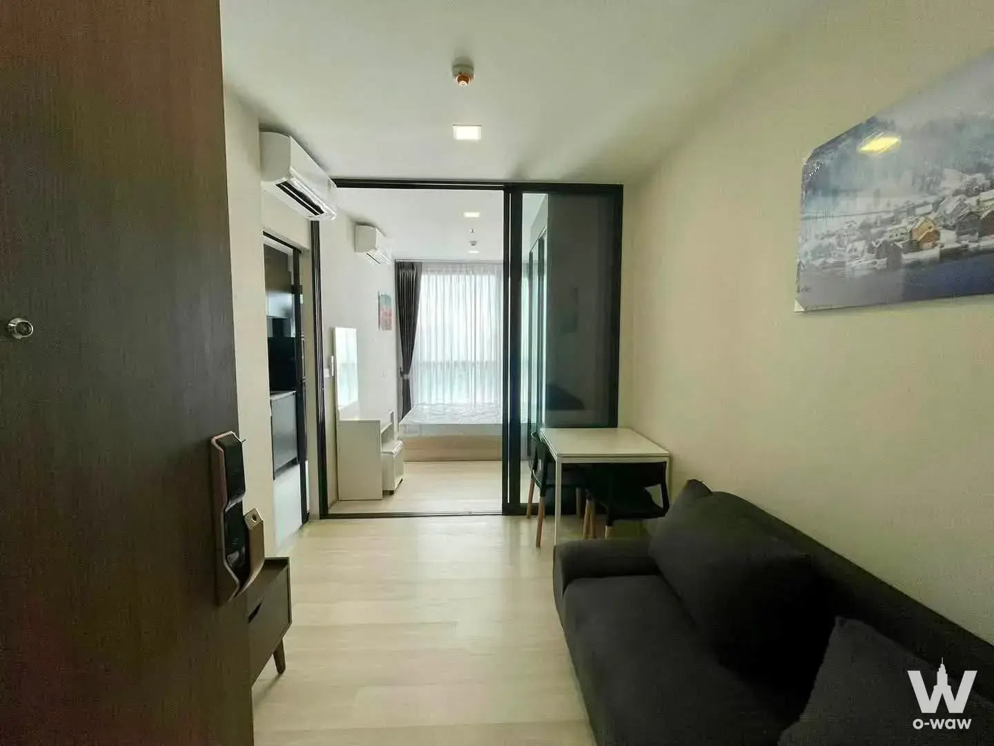 Living room in a 1-bed condo at The Privacy Jatujak with smart lock entry and bedroom partition