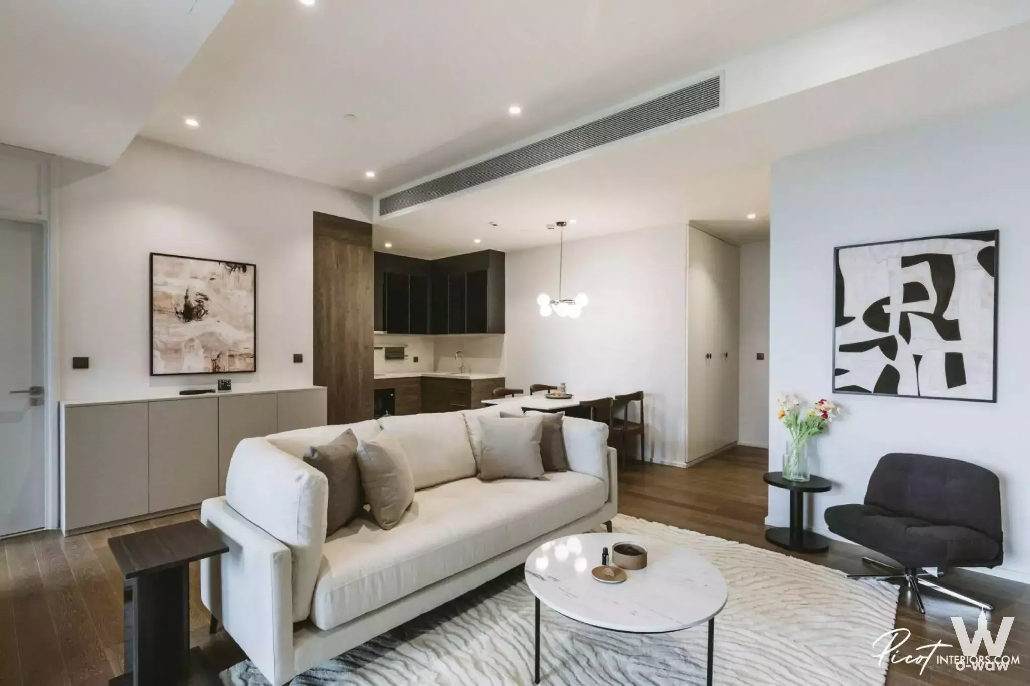 MUNIQ Lang Suan open-plan space featuring marble coffee table and zebra rug