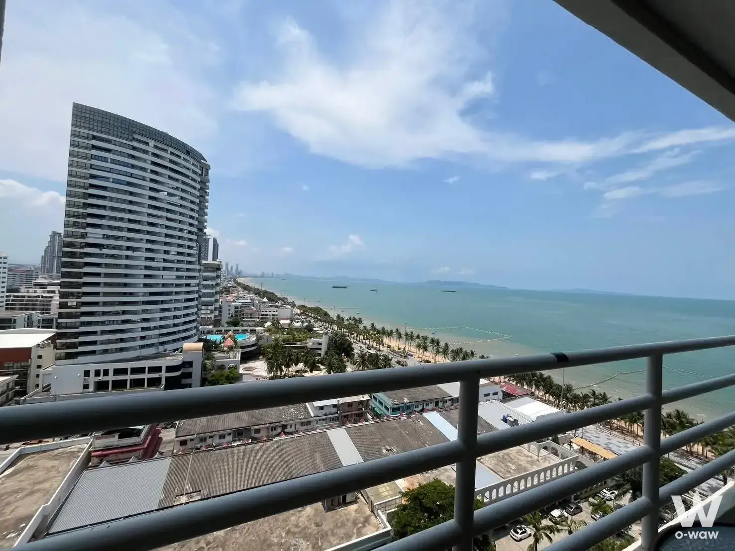 Balcony view from View Talay 8 showing turquoise ocean, islands, and palm trees