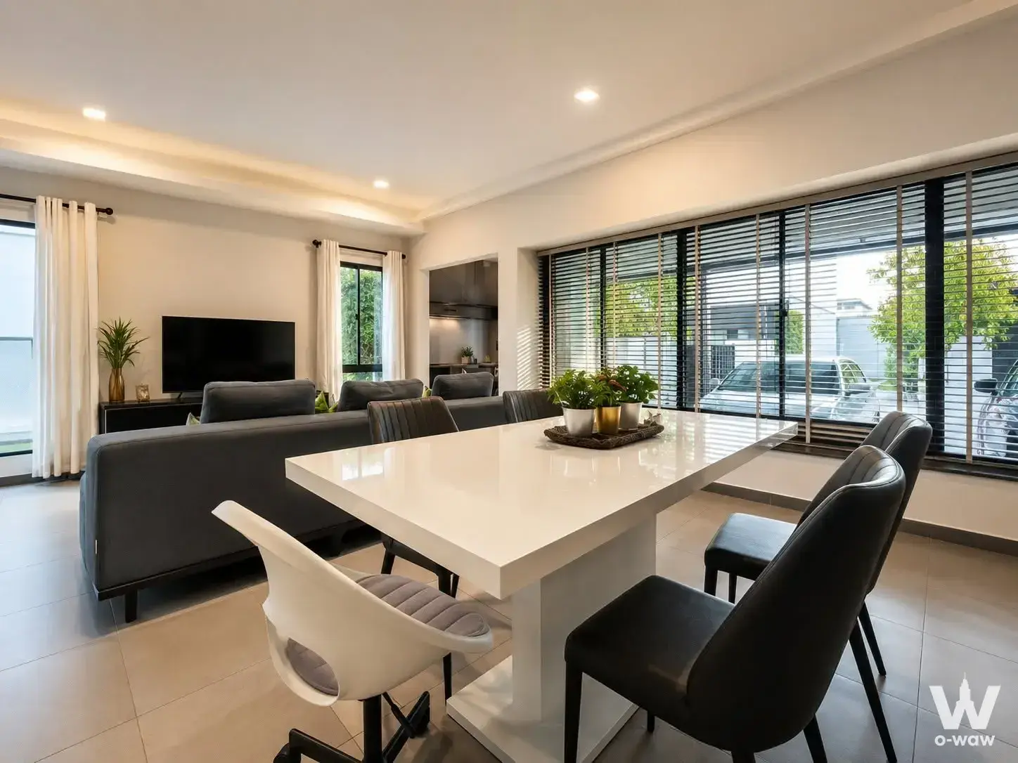 Furnished open-plan living and dining area with sectional sofa at VIVE Bangna KM.7