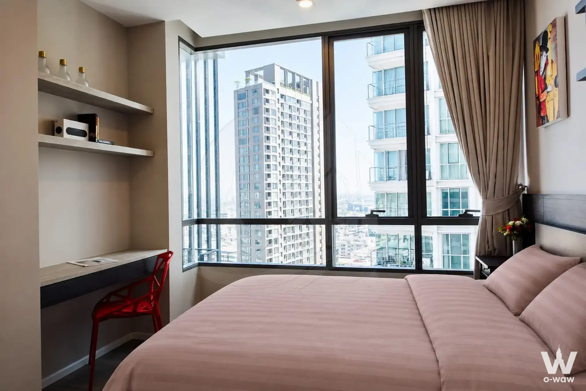 Bright bedroom with city skyline view in 1-bed condo for rent at The Room Sukhumvit 69
