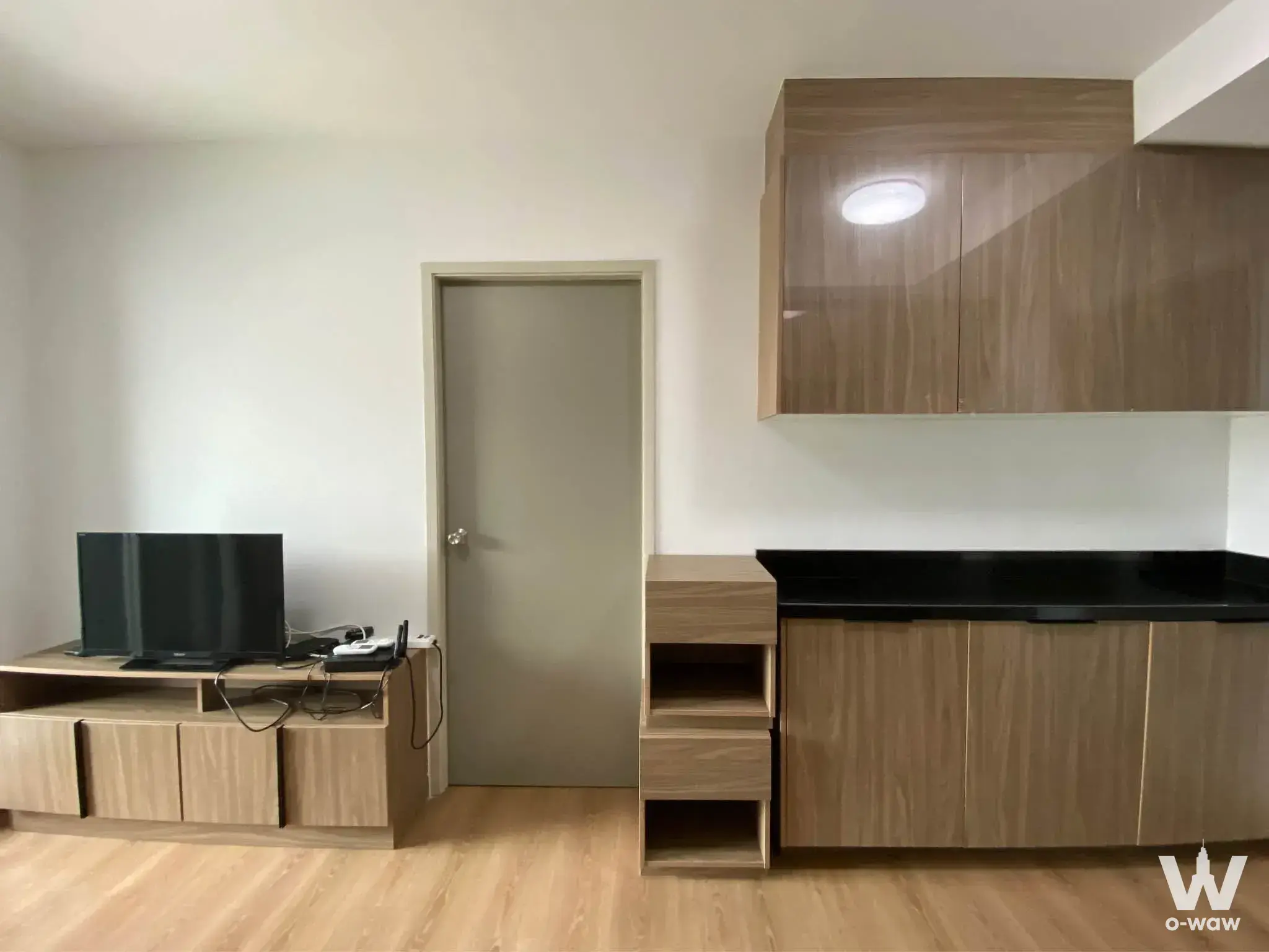 Living room and kitchenette combo for sale in 1-bed condo at Chapter One The Campus Kaset