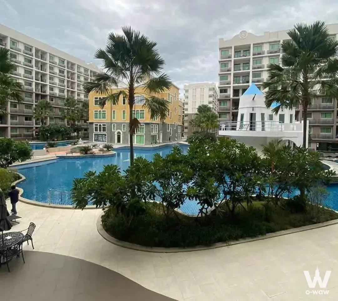 Arcadia Beach Continental outdoor pool area with tropical landscaping and ship structure