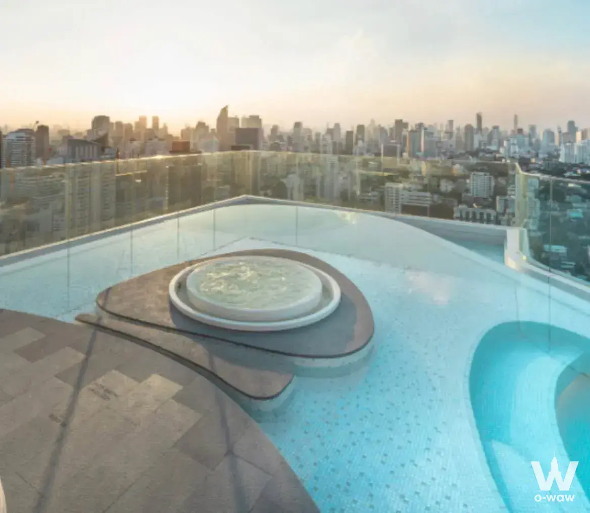 The rooftop infinity pool at XT Ekkamai has a circular jacuzzi and city skyline views