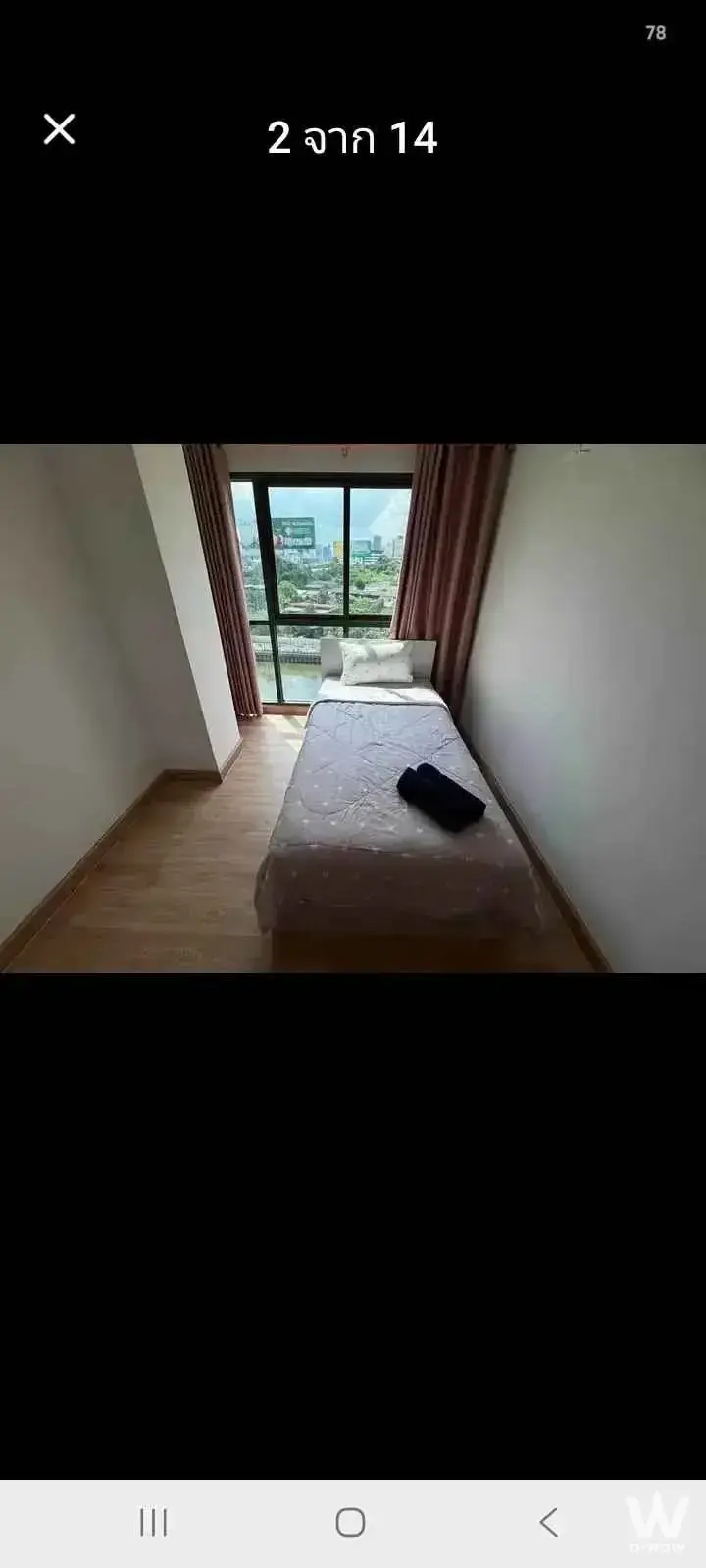 Minimalist bedroom with city view in a 2-bed unit at The Excel Hideaway Sukhumvit 50