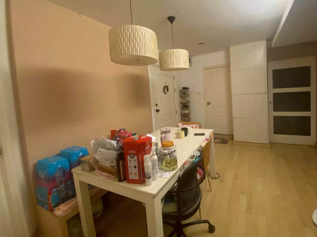 Lived-in dining area with pendant lights and built-in wardrobe in Lumpini Place Rama 3
