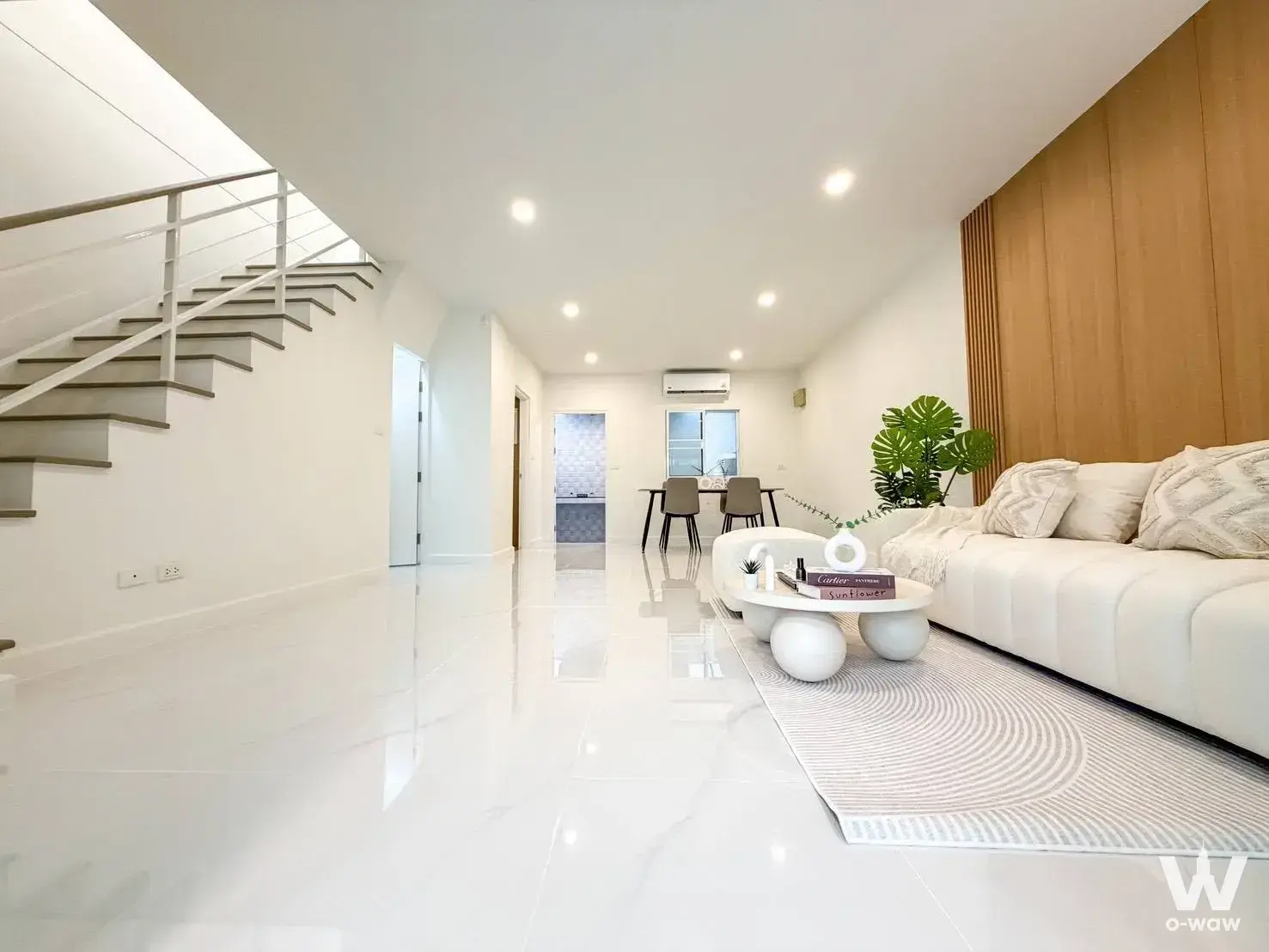 3-bed townhouse for sale in Pleno Pin Klao - Wong Ham with floating staircase, wood feature wall, and marble floors