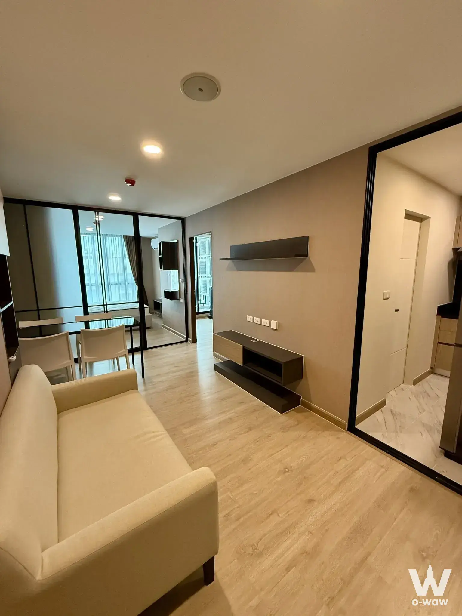 The Cube Urban Sathon - Chan living room with glass partition and minimalist decor