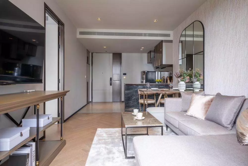 Luxurious open space in THE RESERVE 61 HIDEAWAY with herringbone floors and a marble-topped coffee table