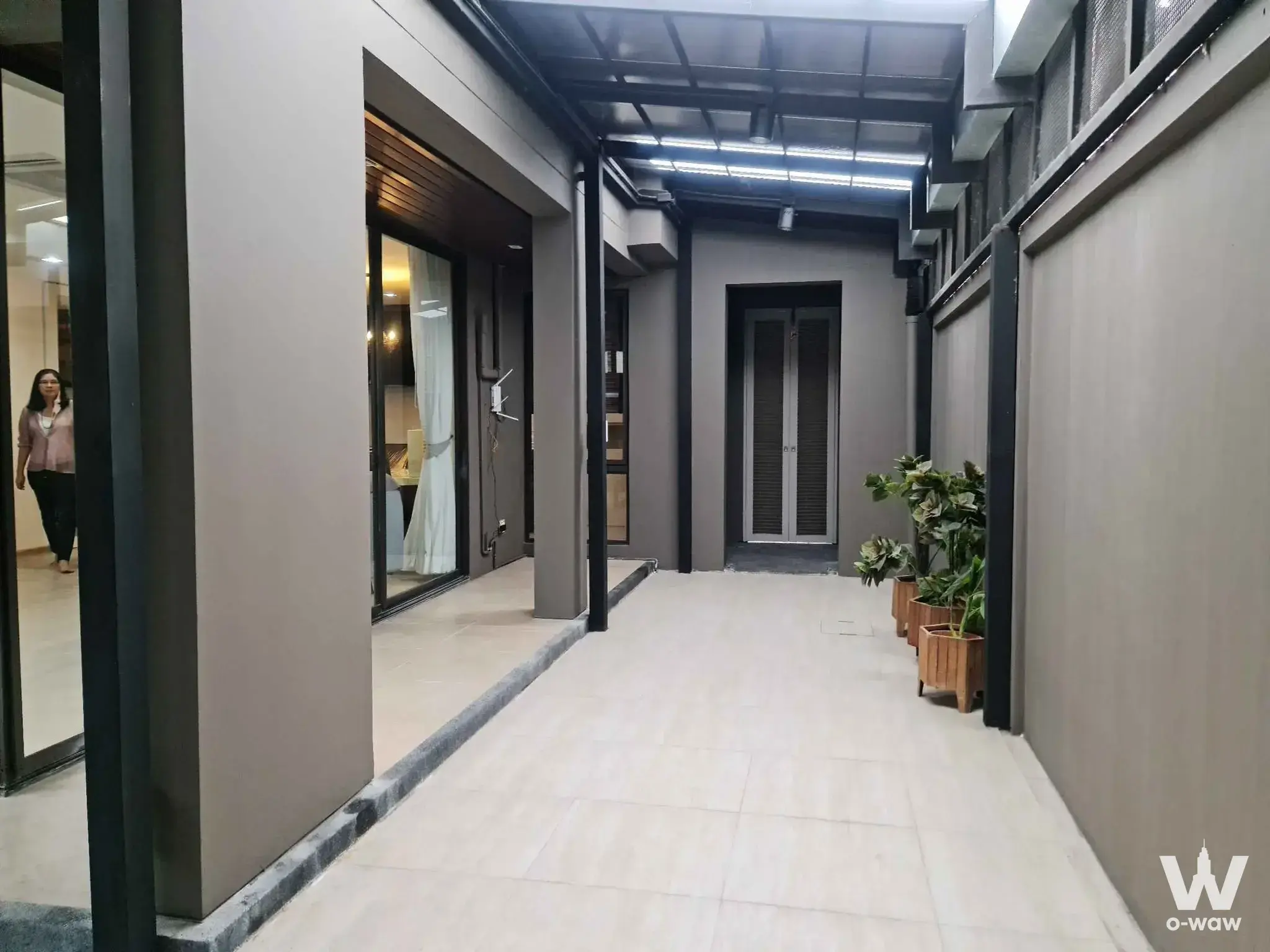 ATRIA Inthamara three-bed house semi-outdoor corridor with polycarbonate canopy