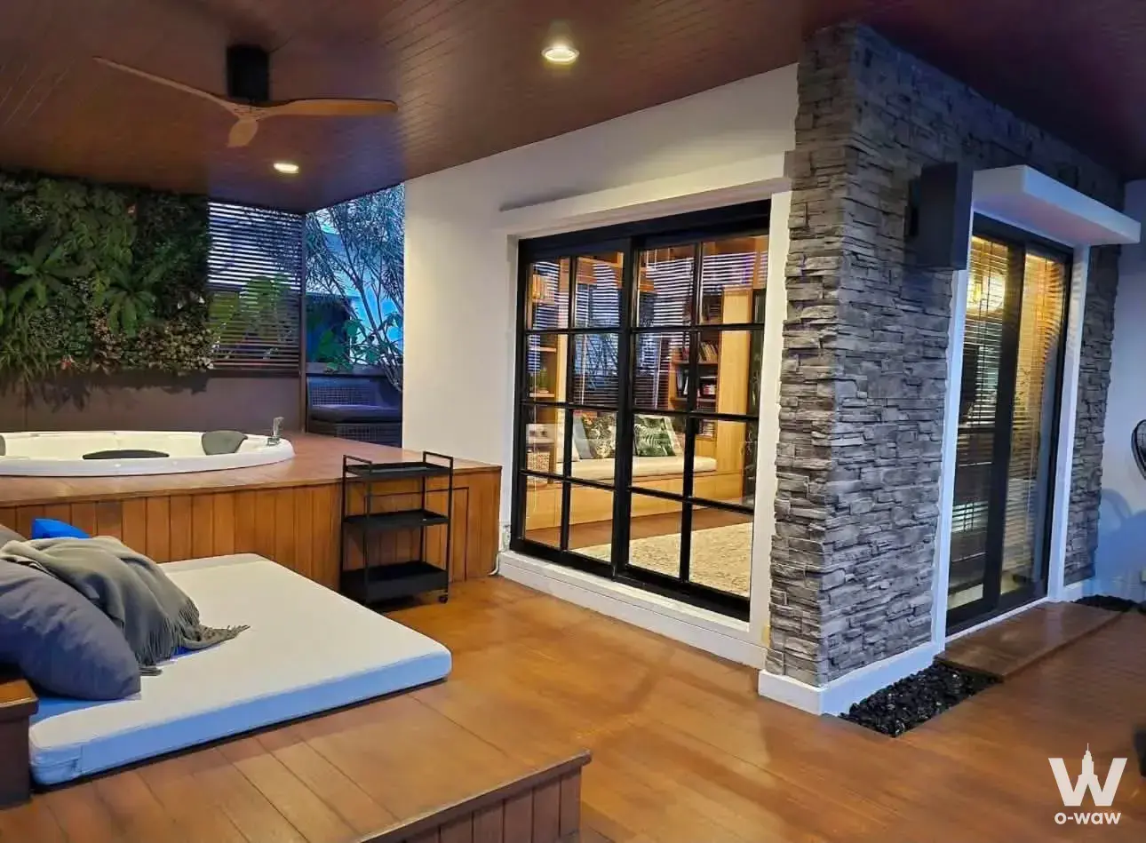 Outdoor spa deck featuring a jacuzzi tub and living wall at this 3-bed Mantana 2 Bangna house for rent