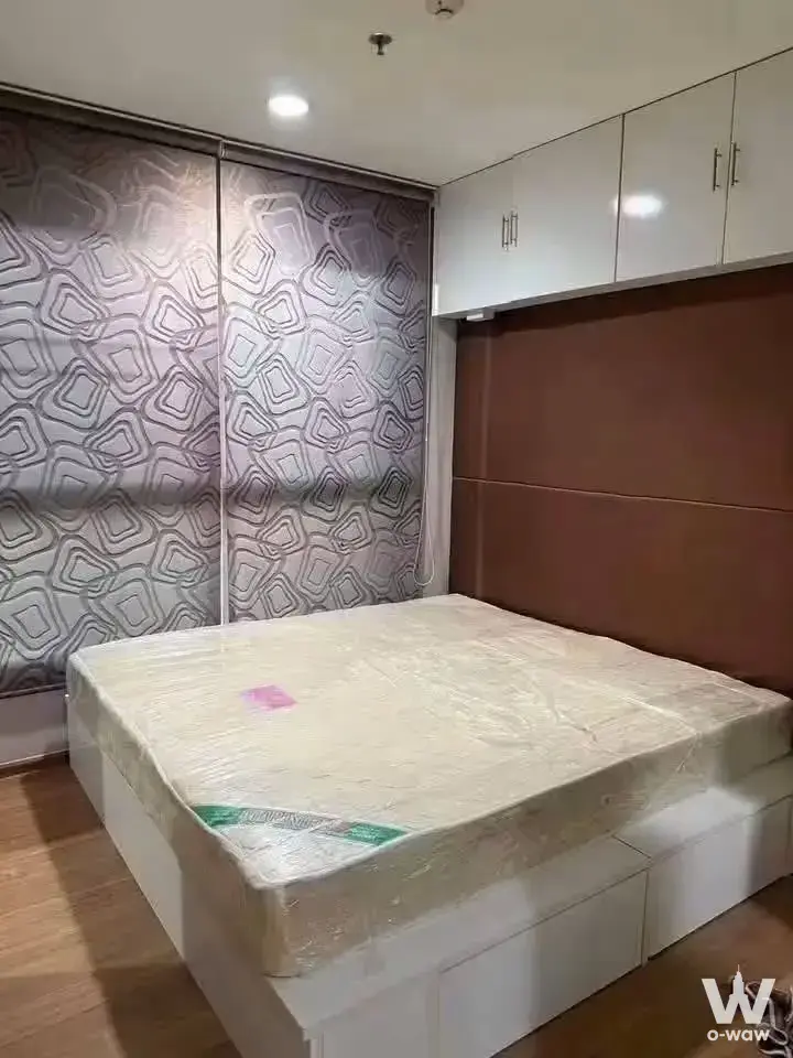 Bedroom with sealed mattress and built-in storage in a Fuse Chan Sathorn 1-bed unit