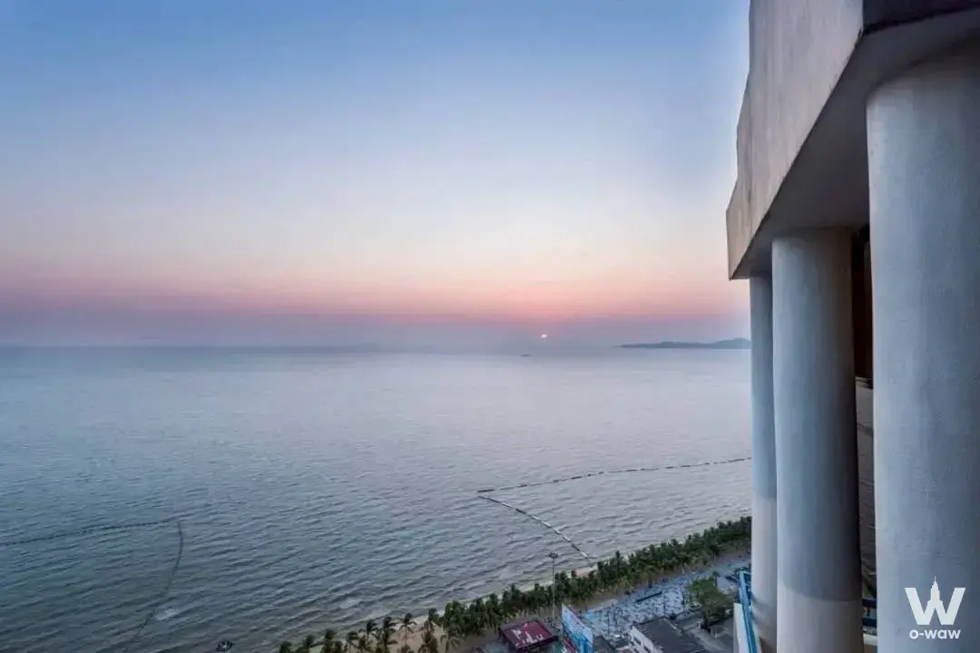 Sunset ocean panorama from the balcony of a 3-bed condo for sale at Jomtien Plaza Condotel