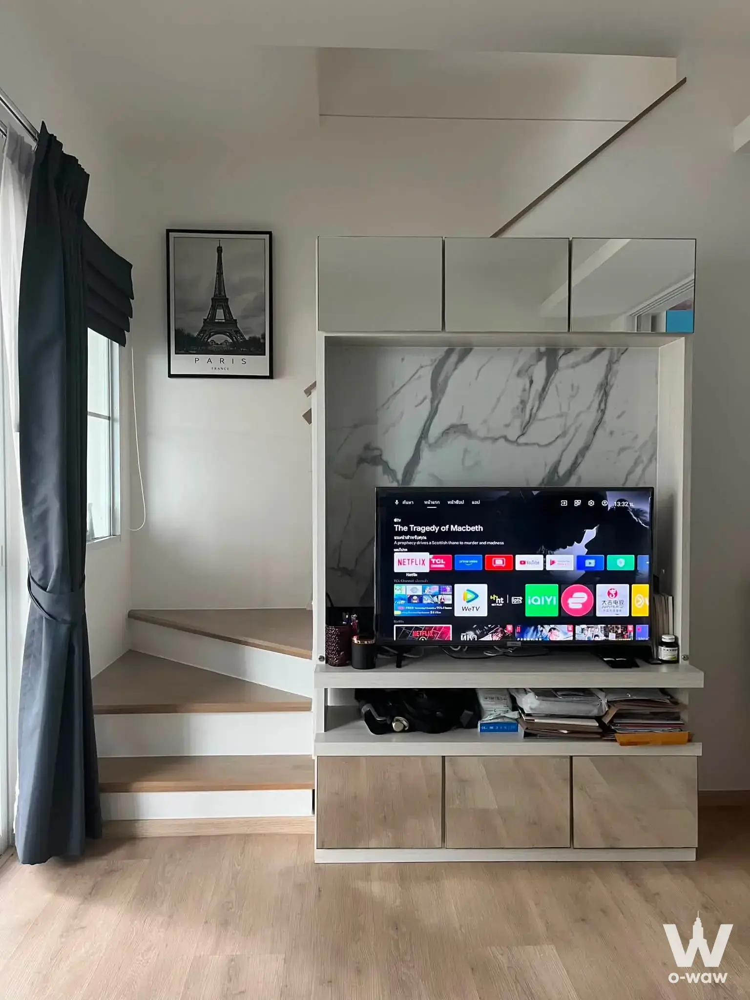 2-bed townhouse for rent in Indy Srinakarin - Praeksa with loft-style living room, light wood floors, and white marble media