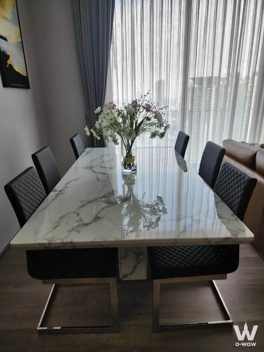 Rhythm Charoenkrung Pavillion 3-bed condo dining room with marble table and city view